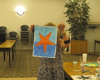 Neighbors | Zack Shively  .Austintown library offered a watercoloring class on Aug. 23. The class had painters of different skill levels, and librarian Andrea Zupcsan helped anyone who needed it.
