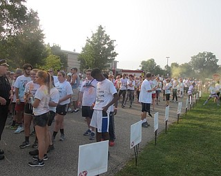 Neighbors | Zack Shively.Runners lined up to run a 5k at the Cam Jaros Color Run at Austintown Middle School on Sept. 17. Three hundred and seventy-six people registered before the event and more registered during it.