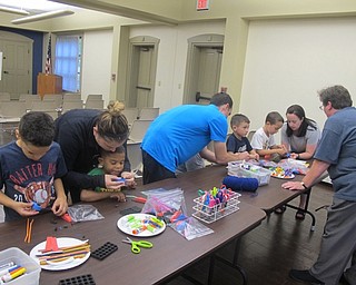 Neighbors | Zack Shively.Boardman library had a crafting portion of their Science Stories with Ryan Martino event. The children and parents made cars from foam parts and drew racetracks on large sheets of paper.