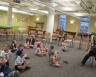 Neighbors | Zack Shively.Children listened to librarian Jennifer Kuczek read "Dragons Love Tacos" at the Poland library on Sept. 19. The library had a special event based around the story.
