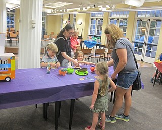 Neighbors | Zack Shively.The "Dragons Love Tacos" event at the Poland library included a crafting table where children could make tacos from pieces of construction paper and glitter glue.