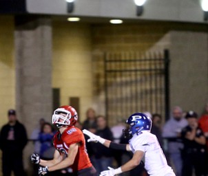 Struthers wide receiver Kevin Caldwell(89) and Poland defensive back Brandon Barringer(13) run for the long pass during the second quarter as Poland High School takes on Struthers High School, Friday, Sept. 29, 2017, at Stuthers High School in Struthers. Poland won 33-0...(Nikos Frazier | The Vindicator)..