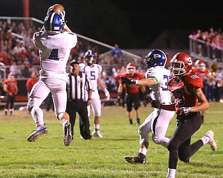 Poland defensive back Mike Diaz(4) intercepts a pass and returns for a touchdown during the second quarter as Poland High School takes on Struthers High School, Friday, Sept. 29, 2017, at Stuthers High School in Struthers. Poland won 33-0...(Nikos Frazier | The Vindicator)..