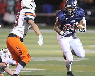 William D. Lewis The Vindicator Fitch's Jakari Lumsden(24) eludes Kameron Simpson(24) of Massillon during 1rst half action 9-29-17 at Fitch.