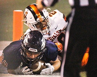 William D. Lewis The Vindicator A  blocked 2nd qtr punt by Massillon is recovered in the endzone by Fitch's Mike Ferree(44).  Defending for the Tigers is Zion Phifer(29).