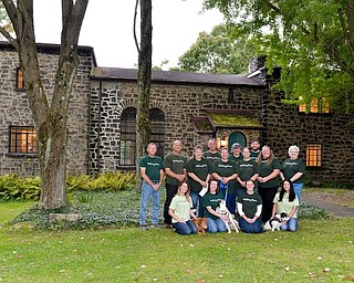 Pictured are the founders and volunteers of Alchemy Acres Animal Sanctuary. Kneeling, from left are Heather Drane, Chanel, Tricia Rogers, Buckeye, Brandi Burns, Sadie and Cherri Piszczek. Standing, from left are Ken Richey, Steve Sacco, Julie Sacco, Steve Boyd, Emily Sacco, Kathy Monteleone, Katie Sacco, Andrew Grueber, Marie Hernandez and Debbie Streeb.