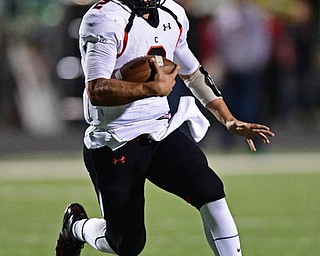 Canfield's Vinny Fiorenza runs the football during the second half of their game Friday night at Boardman High School. Canfield won 17-7. DAVID DERMER | THE VINDICATOR