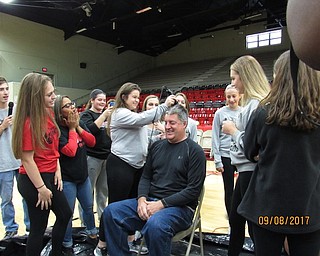 Struthers High School Student Council hosted an assembly recently with a theme “Pie in the Face” to help raise funds to be donated to the Salvation Army for hurricane relief. Students purchased tickets for a chance to pie a teacher of their choice in the face. Pictured above is Ron Lesko having his head shaved by the girl’s golf team because the school surpassed its goal of $300.Below are high school teachers who were “pied” during the assembly.