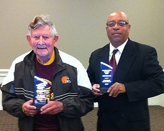 Above, from left, Toastmasters Neil McBride of Warren and Art Byrd of Boardman hold their trophies from the Toastmasters of Warren Humorous Speech and Table Topics contest. Both men competed in the district tournament which included clubs from Youngstown, Allliance and Warren.