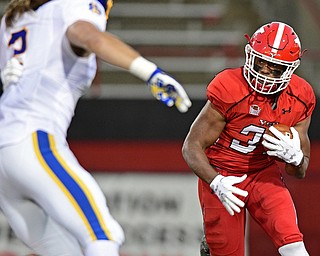 Youngstown State tailback Tevin McCaster(37) runs the ball before being hit by South Dakota State linebacker Christian Rozeboom(2) during the first half of their game Saturday, Sept. 30, 2017, at Stambuagh Stadium in Youngstown, Ohio. ..(David Dermer | The Vindicator)..