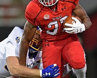 Youngstown State tailback Tevin McCaster(37) runs through the attempted tackle of South Dakota State defensive end Ryan Earith(90) during the first half of their game Saturday, Sept. 30, 2017, at Stambuagh Stadium in Youngstown, Ohio. ..(David Dermer | The Vindicator)..