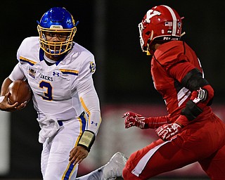 South Dakota State quarterback Taryn Christion(3) runs the ball before being knocked out of bounds by Youngstown State free safety Jalyn Powell(2) during the first half of their game Saturday, Sept. 30, 2017, at Stambuagh Stadium in Youngstown, Ohio. ..(David Dermer | The Vindicator)..