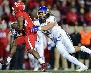 South Dakota State linebacker Christian Rozeboom(2) tackles Youngstown State wide receiver Alvin Bailey(5) during the first half of their game Saturday, Sept. 30, 2017, at Stambuagh Stadium in Youngstown, Ohio. ..(David Dermer | The Vindicator)..