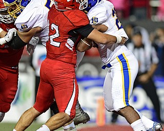 Youngstown State's Armand Dellovade, left, tackles South Dakota State's Mikey Daniel in the end zone for a safety during the second half of their game Saturday at Stambuagh Stadium. Youngstown State won 19-7. DAVID DERMER | THE VINDICATOR