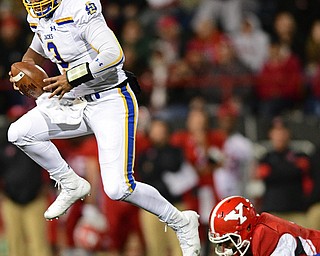 South Dakota State's Taryn Christion jumps after slipping out of a tackle from Youngstown State's Justus Reed during the second half of their game Saturday at Stambuagh Stadium. Youngstown State won 19-7. DAVID DERMER | THE VINDICATOR