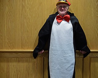 Stephen Hanzely stands in the elevator lobby of Stambaugh Stadium dressed as a penguin before a game between the Youngstown State Penguins and South Dakota State Jackrabbits at Stambuagh Stadium. DAVID DERMER | THE VINDICATOR