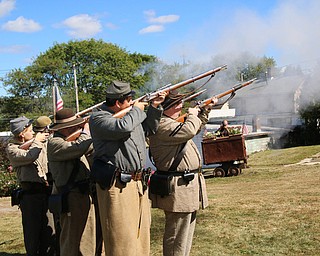 A group of Civil war reinactors fired their rifles during the Struthers Historical Society's open house on Saturday afternoon.  Dustin Livesay  |   The Vindicator  9/30/17  Struthers