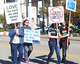 A group holds picket signs during the seventh annual Nonviolence Parade and Rally, Oct. 1, 2017, in downtown Youngstown...(Nikos Frazier | The Vindicator)