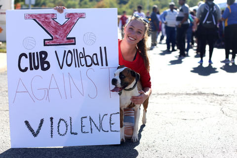 Rebecca Currington and her 4 y/o Boxer Mia pose for a photo during the seventh annual Nonviolence Parade and Rally, Oct. 1, 2017, in downtown Youngstown...(Nikos Frazier | The Vindicator)