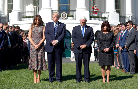President Donald Trump and first lady Melania Trump stand with vice president Mike Pence and his wife Karen during a moment of silence to remember the victims of the mass shooting in Las Vegas, on the South Lawn of the White House in Washington, Monday, Oct. 2, 2017. (AP Photo/Pablo Martinez Monsivais)