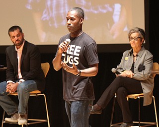 William D. Lewis The Vindicator  2017 Simeon Booker Award for Courage recipient  Ken Nwadike Jr. , center, speaks during 10-3 event at DeYor Performing Arts Center in Youngstown. At left is panelist Wajahat Ali- journalist and at right is Anita Grey- Anti Defamation League.