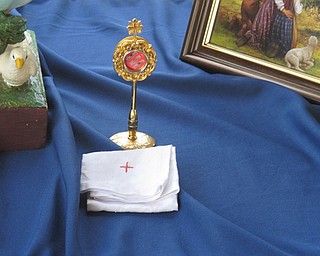 Neighbors | Zack Shively.Relics belonging to Saint Jacinta and Saint Francisco, two of the three children present to witness and speak to Mary at Fatima. Relics were on display at Beeghly Oaks during the celebration of the 100 year anniversary of the Fatima miracles on Aug. 14.