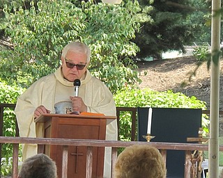 Neighbors | Zack Shively.Monsignor Cariglio led a mass ceremony at Beeghly Oaks as a part of the celebration of Our Lady of Fatima on Aug. 14.