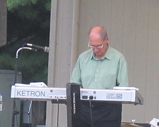 Neighbors | Zack Shively  .Ron Austalosh played both keyboard and accordion at Boardman Park on Aug. 17 as a member of the Del Sinchak Band. He his keyboard both had a setting for a piano sound and an artifical brass sound.
