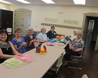 Neighbors | Zack Shively  .The Loose Knit group met Aug. 18 in Boardman library's meeting room to organize projects and donations.