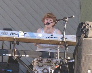Neighbors | Zack Shively  .Soundbite's keyboard player Maureen Murray sings Pat Benatar's "Hit Me With Your Best Shot" at Concert in the Park at Austintown Township Park on Aug. 22.