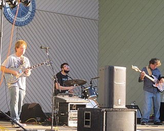 Neighbors | Zack Shively  .Guitarist Tom Shaffer ripped off a solo while drummer T.J. Costanza and bassist Tom Davies kept the rhythm of the song going at Austintown Township Park on Aug. 22.