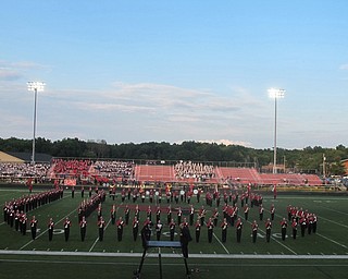 Neighbors | Zack Shively  .Canfield Marching Band opened Canfield High School's Show of the Bands on Aug. 29 with their alma mater, "Hang on Sloopy" and "The Star Spangled Banner."