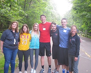 Neighbors | Zack Shively  .The crew for Mill Creek's "Let’s Move! A Walk for Those with Mobility Challenges" at the East Golf Hike Bike Trail on Aug. 31. Pictured are Mill Creek Metroparks representative for the event Carol Vigorito on the left, Professor of execise science at YSU Dr. Nicole Mullins on the right, and Mullins's students in the center.