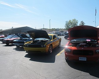 Neighbors | Zack Shively.Car enthusiasts registered 70 vehicles to the Pink Ribbon Car Show. They had food, drinks, a bounce castle, a raffle and bake sale.