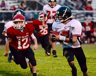 Neighbors | Submitted .Canfield Village Middle School football player Jeff Demarco sprinted to the end zone in a recent game against Struthers.