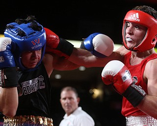Sylvio Cercone(black) tries to doge a punch from Luca De Chiara(red), Thursday, Oct. 5, 2017, at the Covelli Centre in Youngstown. Cercone won after three rounds by points...(Nikos Frazier | The Vindicator)..