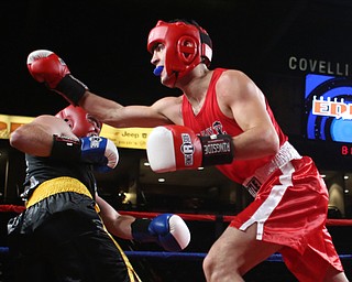 Paul Palombo(black) takes on Daniele Pucciarelli(red), Thursday, Oct. 5, 2017, at the Covelli Centre in Youngstown. Palombo won after three rounds by points...(Nikos Frazier | The Vindicator)..