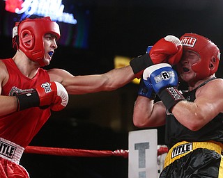 Paul Palombo(black) takes on Daniele Pucciarelli(red), Thursday, Oct. 5, 2017, at the Covelli Centre in Youngstown. Palombo won after three rounds by points...(Nikos Frazier | The Vindicator)..