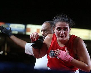 Jessica Palmieri(red) bows after being announced winner by Official Doug Patterson, Thursday, Oct. 5, 2017, at the Covelli Centre in Youngstown. Palmieri won after three rounds by points...(Nikos Frazier | The Vindicator)..