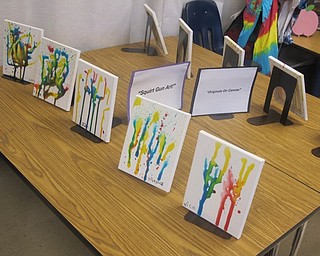 Neighbors | Zack Shively.The kindergarten students at St. Charles School created a variety of artwork for their Art Exhibition on Sept. 26. Some forms of art the children used were squirt gun art, still life, chalk and tie-dye.