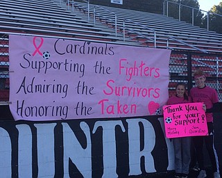 Neighbors | Abby Slanker.Canfield High School National Honor Society seniors and varsity soccer players Macey Malinky and Sam Accordino raised breast cancer awareness for their NHS service project during a Pink Out at the girls junior varsity and varsity soccer games against North Canton Hoover, and the boys junior varsity and varsity soccer games against Lake Catholic on Sept. 30.