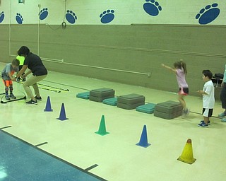 Neighbors | Zack Shively.The Big Dogs helped the Little Dogs go through a course during Mark Wesolowsky's pyshical education class for the Big Dog-Little Dog program on Sept. 26.