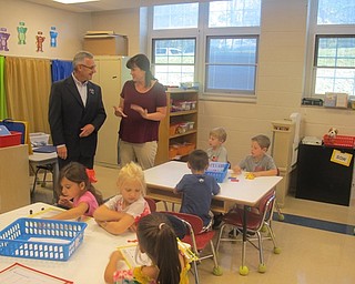 Neighbors | Zack Shively.Jim Tressel met with kindergarten teacher Kirsten Jacobs during the Big Dog-Little Dog program at Poland Union Elementary on Sept. 26. High school students come to Union Elementary on Tuesdays to mentor and help the younger students for the program.