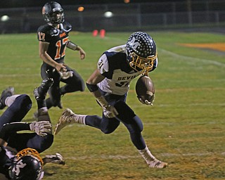             ROBERT  K. YOSAY | THE VINDICATOR..McDonald at Mineral Ridge..#31 Alex Citron McDonald goes for the goals as#17 Min Ridge Dakota Edwards gives chase-  on the ground is #33.. not named in program