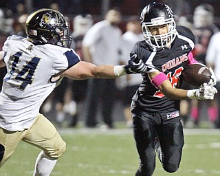 William D. Lewis The Vindicator Girard's Morgan Clardy(16) eludes Brookfield's Alex Clark(14) during 10-6-17 action at Girard.