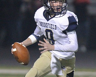 William D. Lewis The Vindicator Brookfield QBHaden Gibson(9) scrambles during 10-6-17 action at Girard.