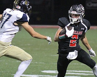 William D. Lewis The Vindicator Girard's Michael Belcik(2) seludes Brookfield's Alex Bell(17)during 10-6-17 action at Girard.