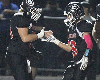 William D. Lewis The Vindicator Girard's Morgan Clardy(16) gets congrats from Patrick Ledenko(58) after scoring during 10-6-17 action at Girard.