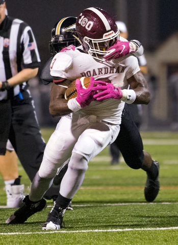 MICHAEL G TAYLOR | THE VINDICATOR- 10-06-17  FOOTBALL Boardman Spartans vs Warren Harding, Harding High School, Mollenkopf Stadium, Warren, OH..1st qtr., Boardman's Domonhic Jennings #3 runs for a 1st down as Harding's  Jeremy Wilson #3 picks up a face mask penalty.