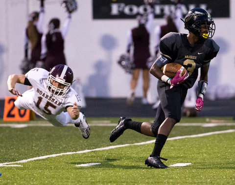 MICHAEL G TAYLOR | THE VINDICATOR- 10-06-17  FOOTBALL Boardman Spartans vs Warren Harding, Harding High School, Mollenkopf Stadium, Warren, OH..1st qtr., Harding's Jeremy Wilson #3 runs for a 56 yards TD punt return as Boardman's Jacob Mahood #15 makes diving tackle attempt